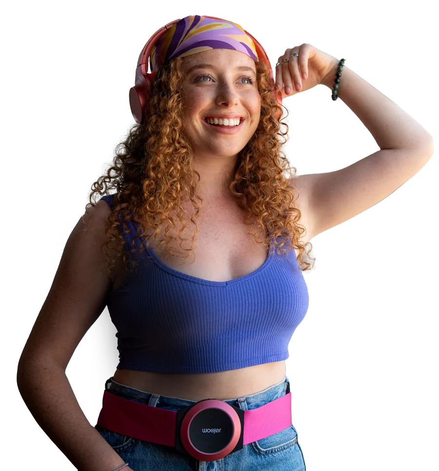 a woman with a blue shirt and red hair with a blue and pink headband