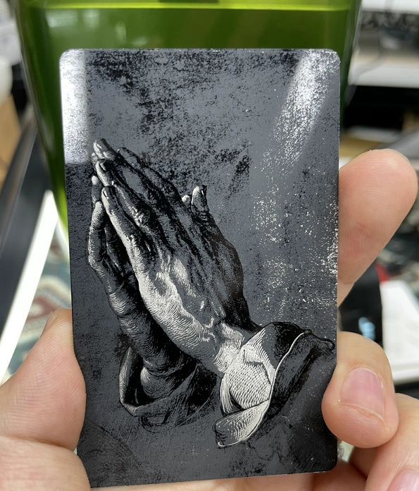 engraved Praying Hands on metal business card