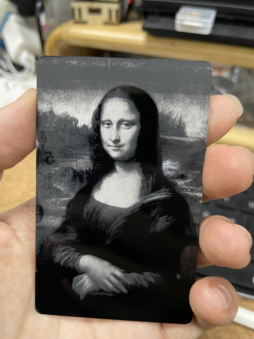 engraved Mona Lisa's Smile on metal business card