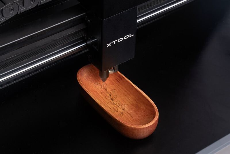 wood laser cutter featuring curved engraving