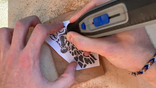 outline the wood engraving's design with a dremel