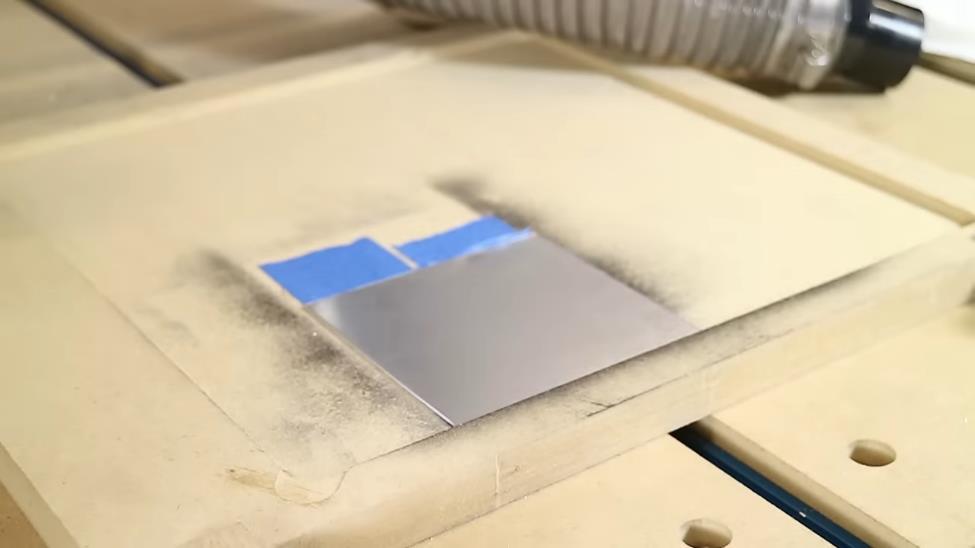 secure the metal sheet onto the cnc machine