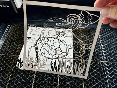 cleaning and painting the laser cut art