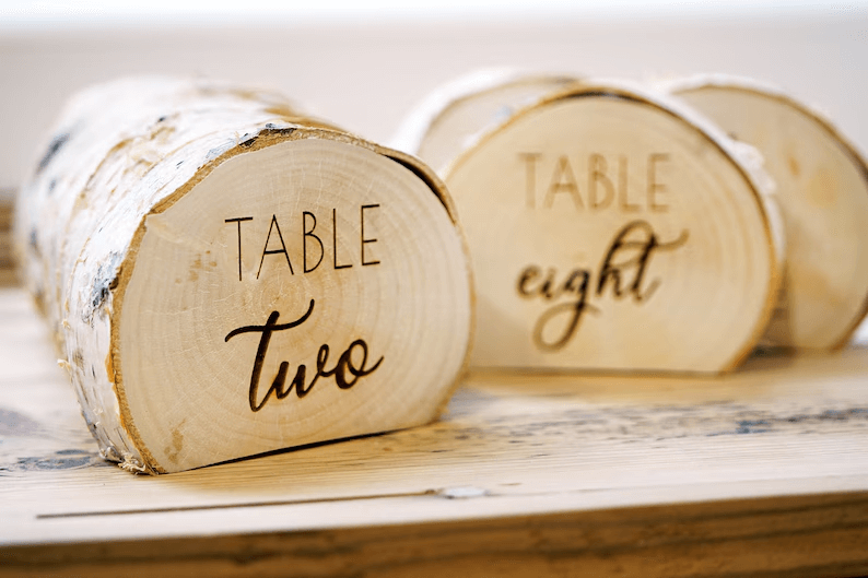 wood engraving idea: engraved wedding table numbers