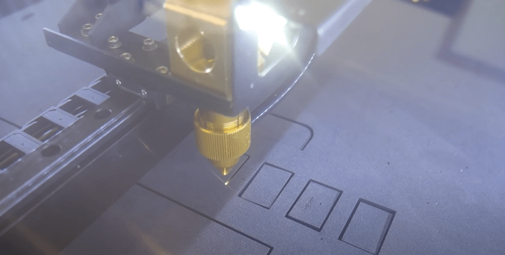 a laser machine cutting on foam