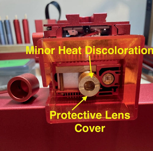 protective lens cover with heat discoloration