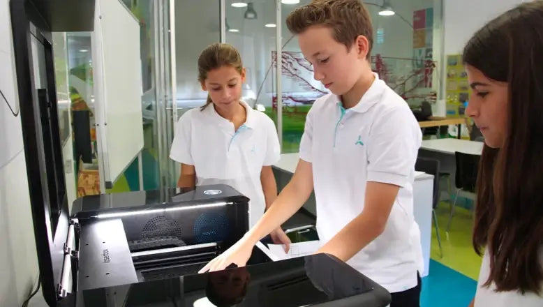 students using laser cutter