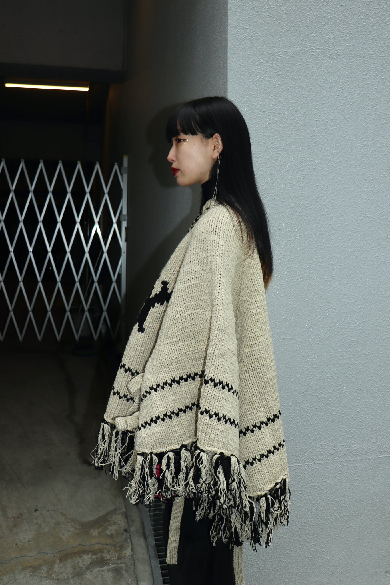 Styling image using Belper 22AW COWICHAN KNIT PONCHO