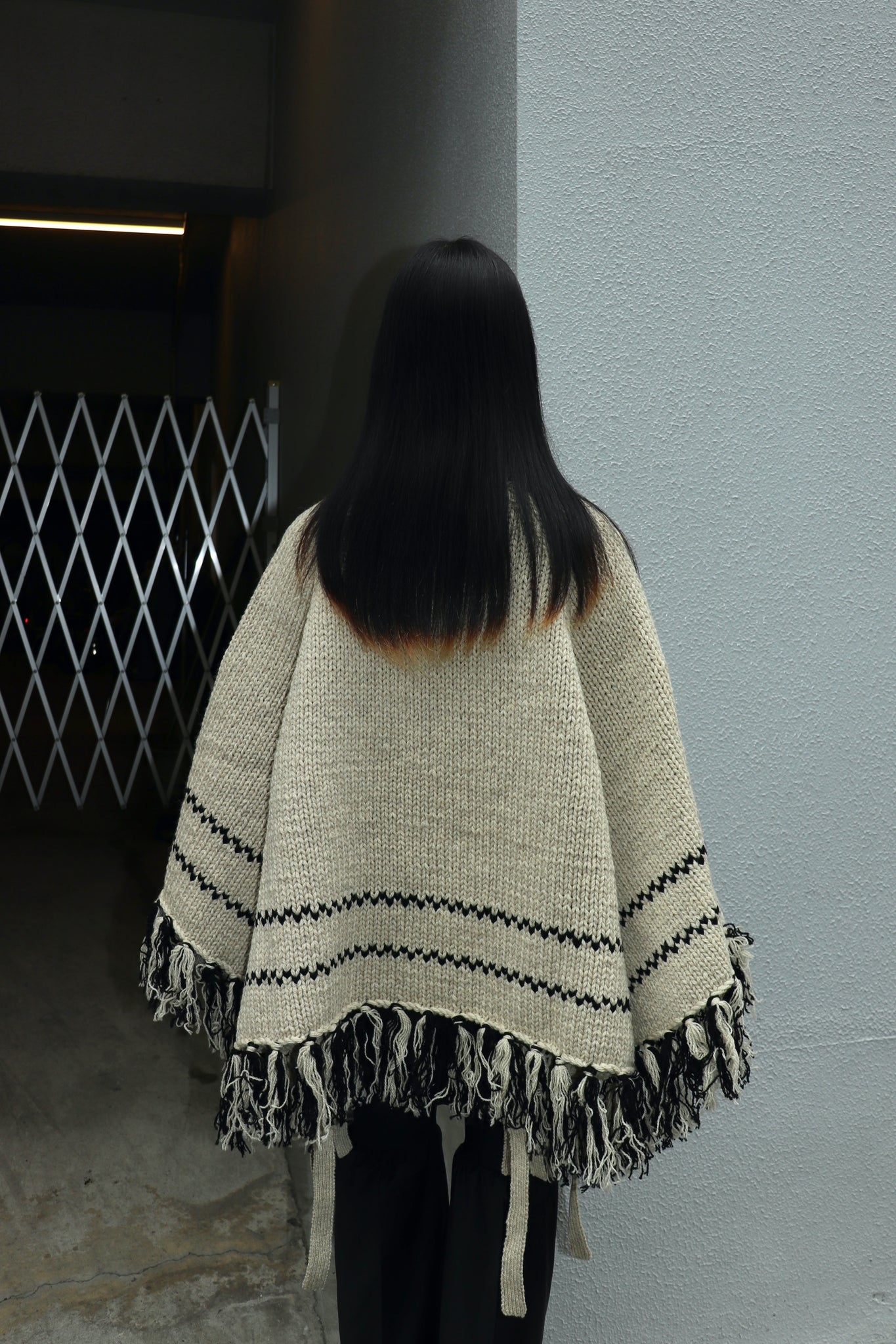 Styling image using Belper 22AW COWICHAN KNIT PONCHO