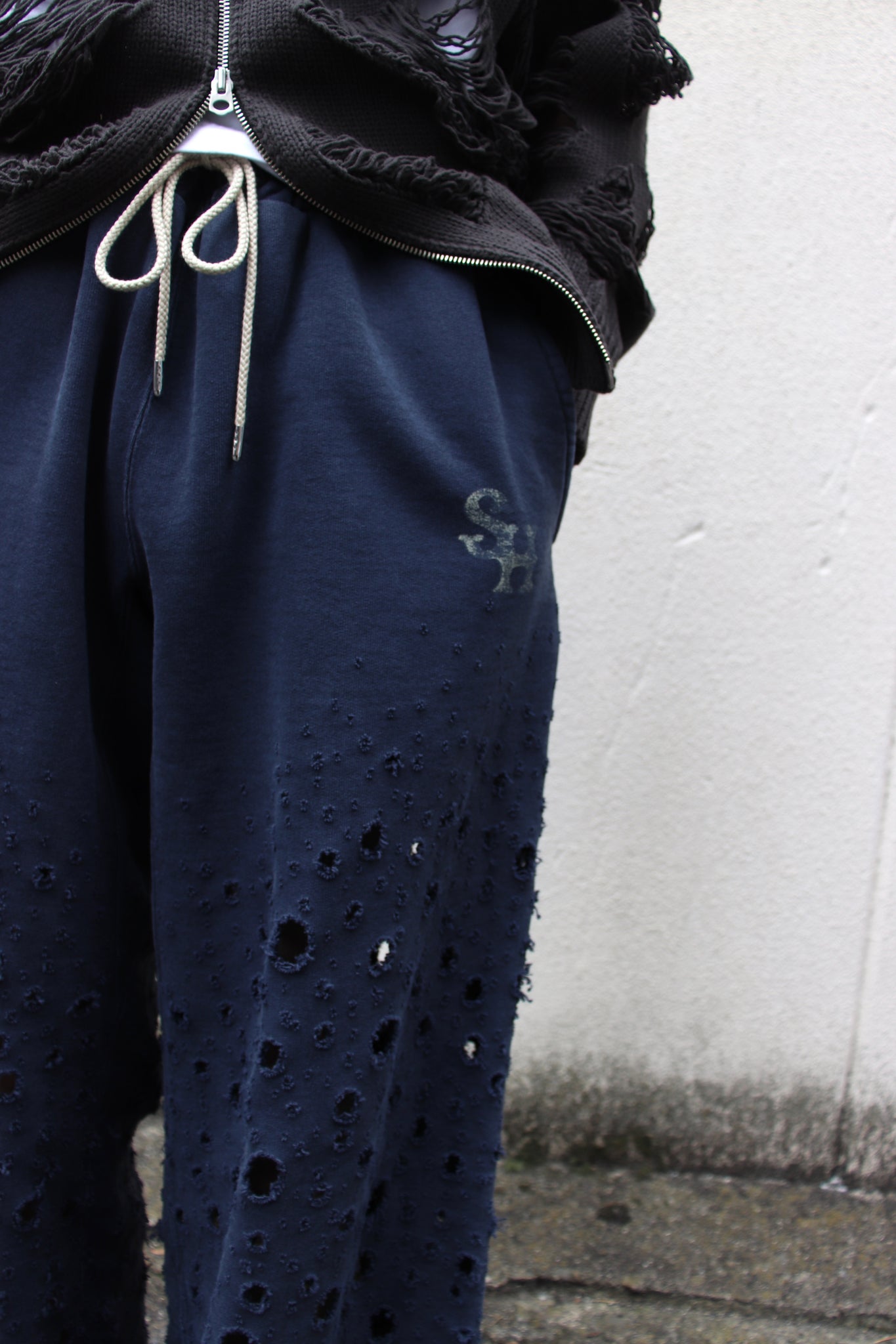 SUGの24ssの CRASHED SWEAT TROUSERS