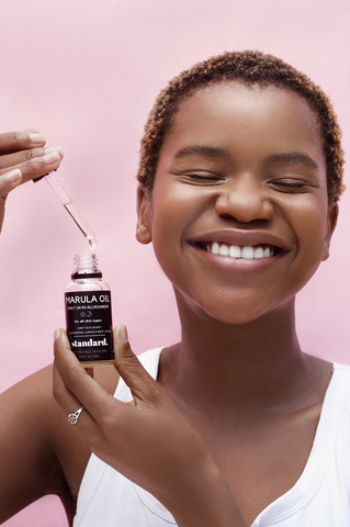 The lovely Zim enjoying the non-greasy, hydrating effects of our Marula Oil Serum