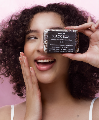 Standard Beauty model holding African Black Soap | Skincare products for all skin types