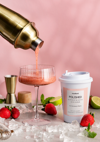 Body scrub next to strawberry daiquiri cocktail | Standard Beauty