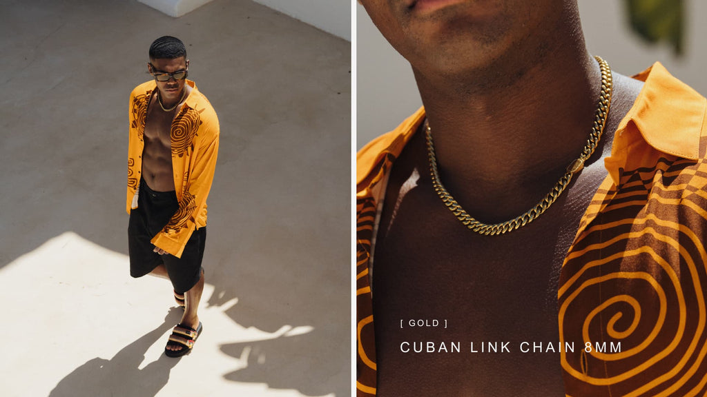 Man wearing an orange open shirt with a statement Gold Cuban Link Chain