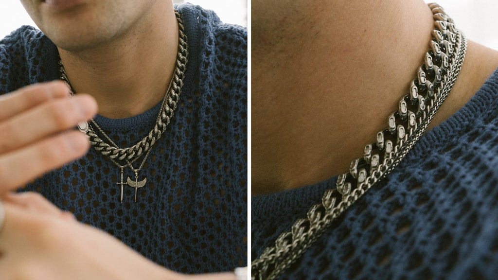 Man wearing thick cable blue jumper and statement Silver Cuban Link Chain