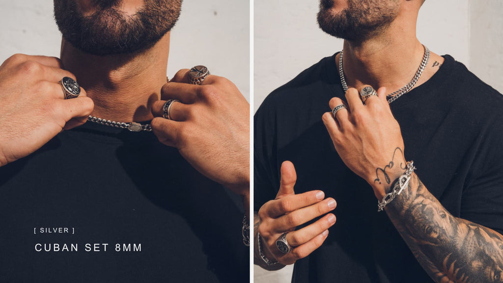 Man wearing plain black t-shirt with a Silver Cuban Link Chain