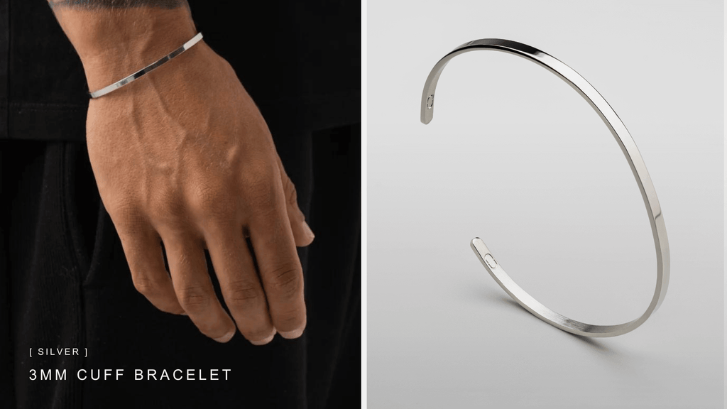 Man's wrist dropping down and styling an understated silver cuff bracelet