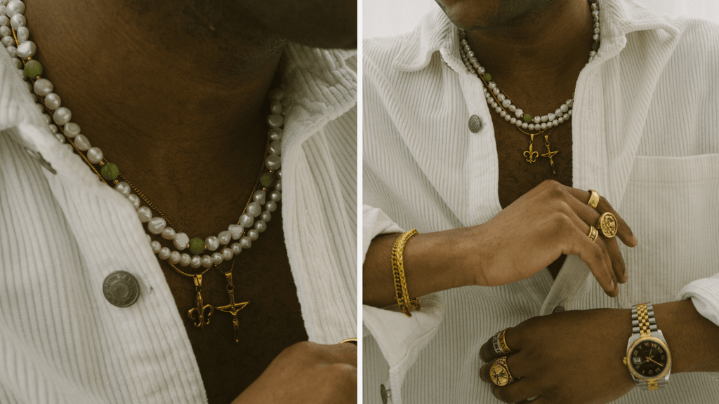 Man wearing a white shirt with all kinds of different 18K Gold Jewellery including rings, bracelets, chains and pearls