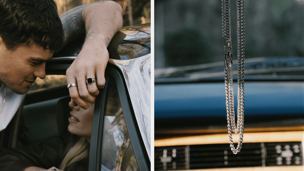Man leaning over a classic car whilst wearing a Classic Cuban Link Chain. A sterling Silver Cuban Chain also hangs from the rear view mirror