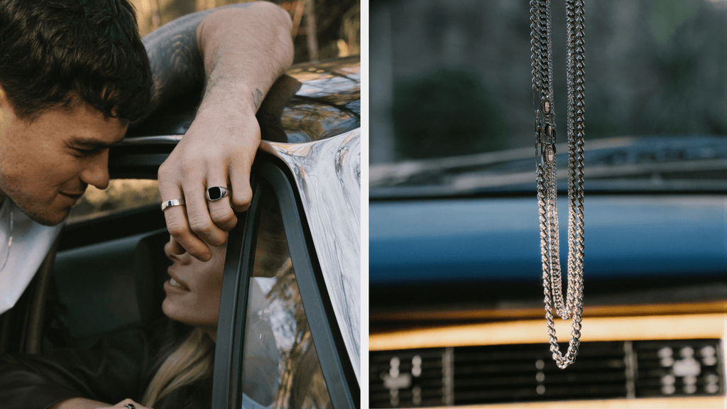 Man leaning over a car door looking at a girl. He is wearing a sterling silver necklace and other silver rings