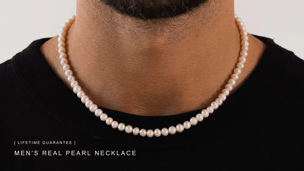 Man with black t-shirt wearing a classic set of men's freshwater pearls