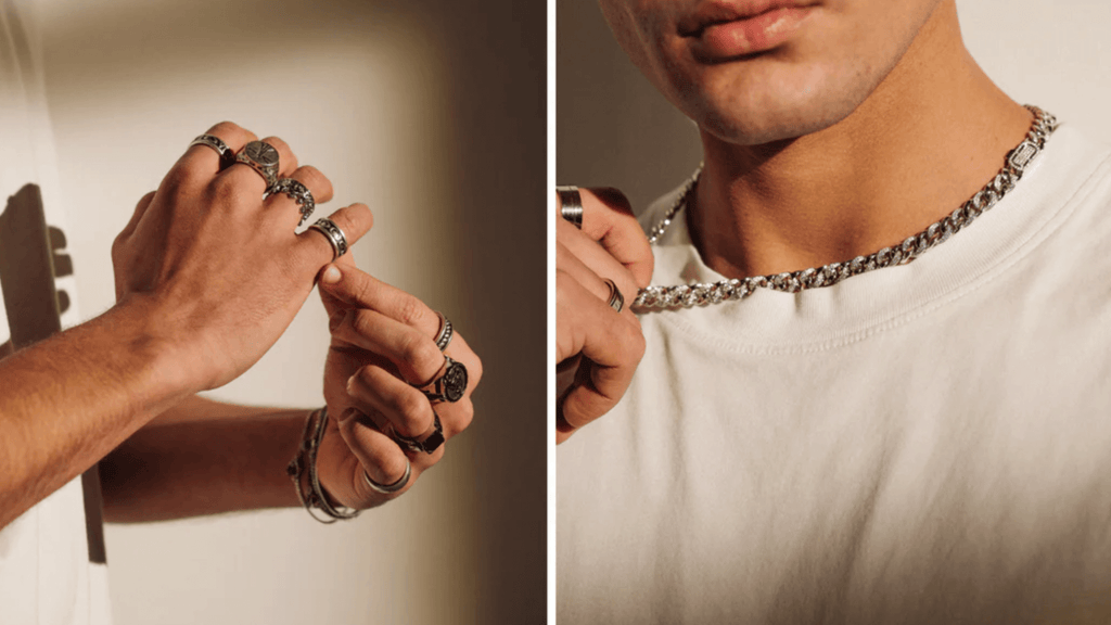 Man with a basic white shirt holding onto a thick silver ICED-out Cuban Link Chain