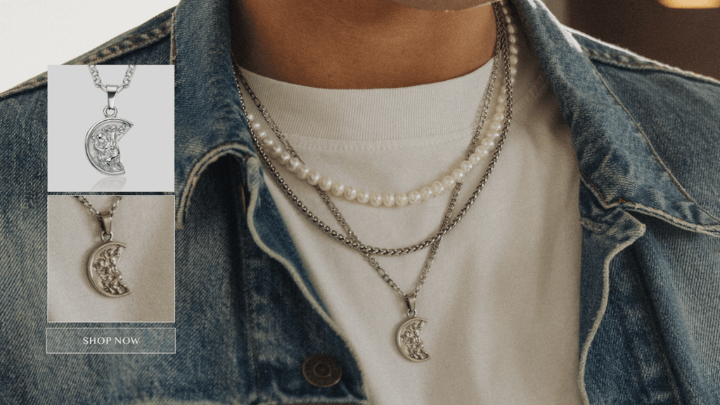 Close up shot of man wearing different layers of men's stainless steel jewellery including a chain, pendant and set of men's pearls