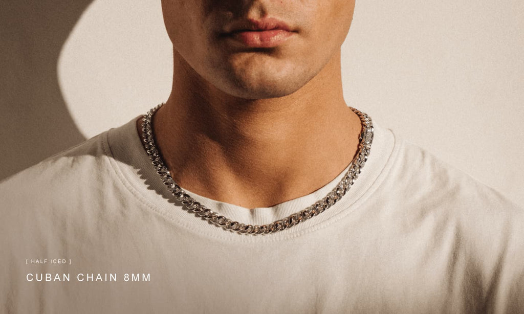 Man wearing a plain white t-shirt and styling an ICED Cuban Link Chain in Silver