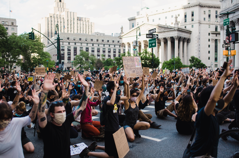 Image of people marching in protest.