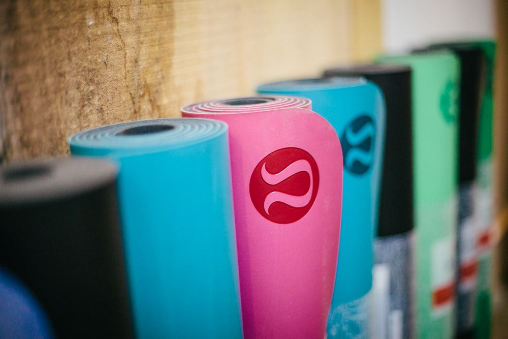 A selection of Lululemon yoga mats in various colours. 