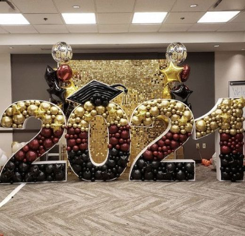 These tri-colored numbers made from balloons make fun graduation party decor.