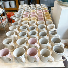 Mugs being glazed
