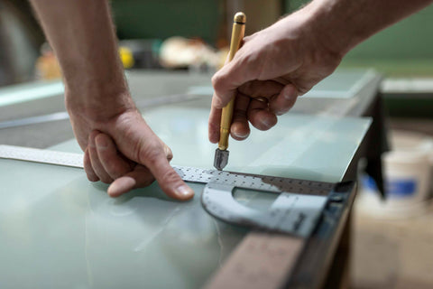 Man measuring and cutting Polycarbonate Sheets | Material Solutions