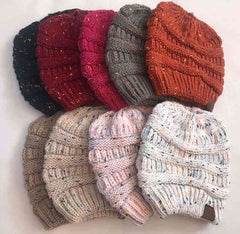 Stock of beanie collection of messy bun hole at top hat during winter