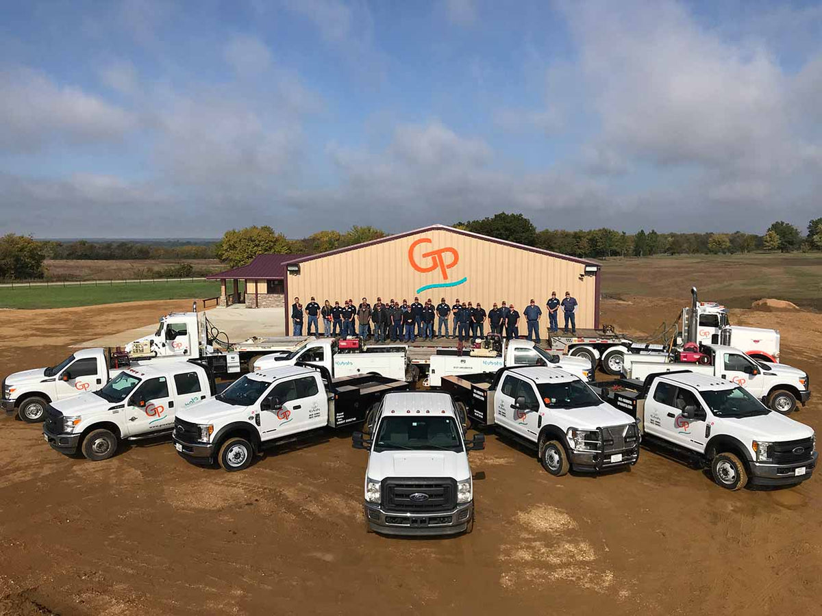 Staff and trucks parked outside Great Plains Kubota