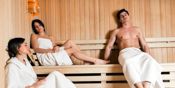 A Beautiful Woman Wearing A White Towel Takes A Sauna The Sauna Is