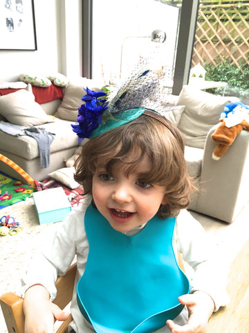 Step-brothers toddler wearing mum's fascinator