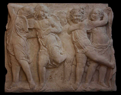 photo of plaster cast relief of children dancing with black background