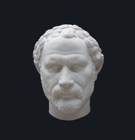 Photo of plaster cast of Demosthenes Mask on a black background