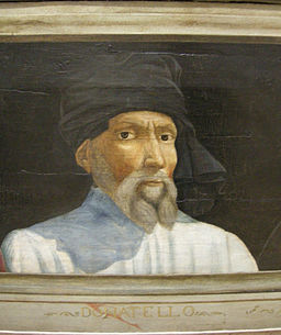 Photo of bust-length portrait painting of Donatello in white shirt and black head wrap against dark background