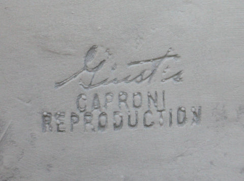 Photo of company stamp in a plaster cast sculpture