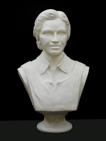Photo of plaster sculpture of Rosa Parks on a black background
