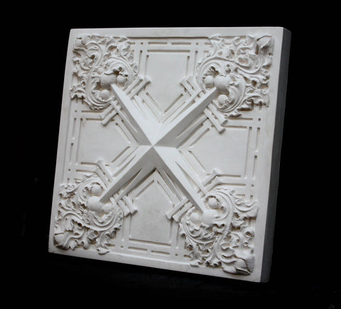 Photo of white plaster cast of architectural ornamentation detail