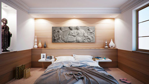 Photo of a plaster Cast of a nude man and woman and two cupids over an unmade bed in a modern bedroom