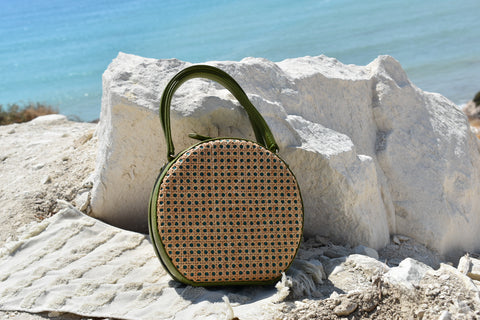 ILHA Francesca Olive ntaural fibres handbag, white rocks backdrop