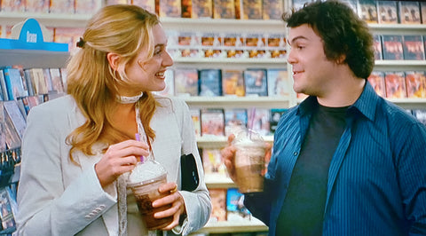 The Holiday still - Kate Winslet carries tiny bag with Jack Black in video store