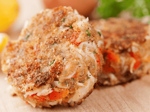 Close-up of two freshly made spicy crab cakes