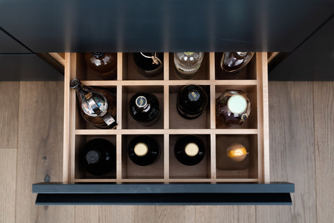 Liquor drawer with square dividers viewed from above 