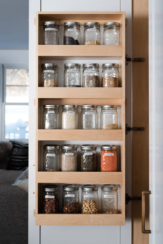 Interior pantry door with mason jars for rice and staples 