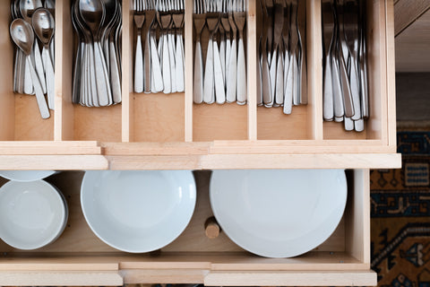 Plate and utensil drawers in kitchen island viewed from the top 